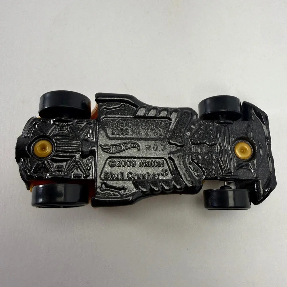Hot Wheels Skull Crusher 2009 Mattel Gold Black Skeleton Diecast Car 1:64 Scale